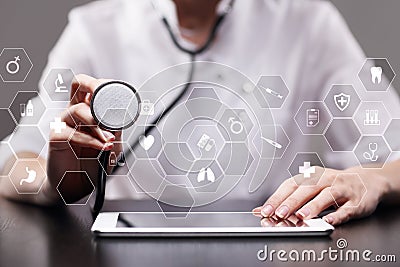 Medicine technology and healthcare concept. Medical doctor working with modern pc. Icons on virtual screen. Stock Photo