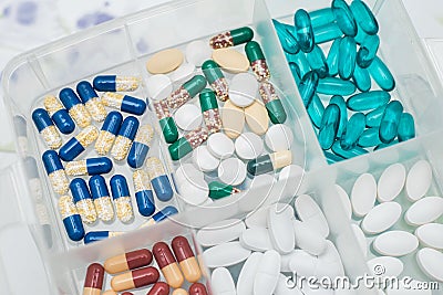 Medicines in a container, various medications for the prevention of viral infections, relieving symptoms, flu and colds Stock Photo