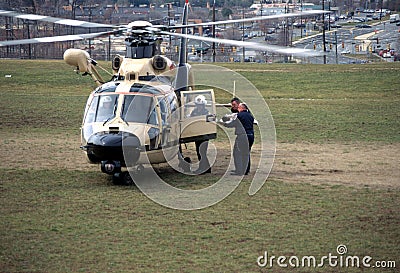 Medics rush an injured child to helicopter Editorial Stock Photo