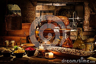 Medieval ancient kitchen tabe with typical food in royal castle Stock Photo