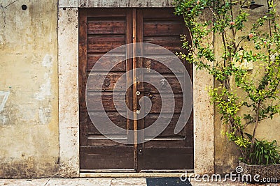 Vintage wooden door. Front view facade. Europe, Italy, Verona Stock Photo