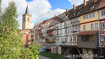 Medieval arch bridge Krämerbrücke crossing river Gera with half-timbered shops and houses in the city of Erfurt, Germany Stock Photo