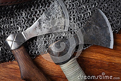 Medieval battle axes on chain mail armor Stock Photo