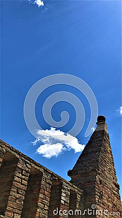 Medieval building, tower, sky and clouds, eternity and history Stock Photo