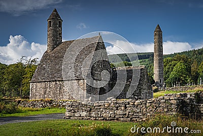 Medieval church, ancient graves, Celtic crosses in Glendalough Cemetery, Ireland Editorial Stock Photo