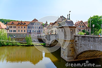 Historic houses, ancient city wall tower and bridge, half-timber houses in Schwabisch Hall, Germany Editorial Stock Photo