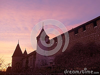 Medieval City Walls with Wall Towers in Murten in Switzerland at sunset. Stock Photo