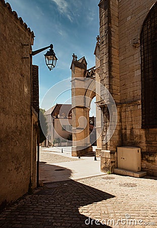 Medieval Collegial Notre Dame in Beaune. View from a side street Stock Photo