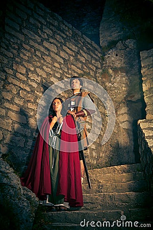 Medieval Couple With Fortress Stock Photo