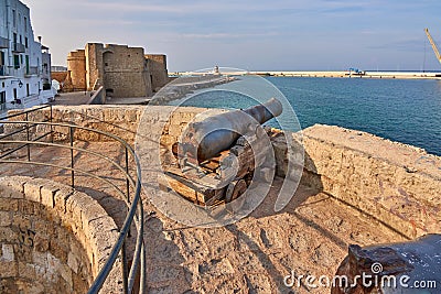 Medieval Defense Cannon and Turret In Front Of Castle Carlo V in beautiful Monopoli - Apulia - Puglia - Italy Stock Photo