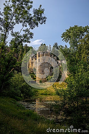 The medieval dilapidated ruin with the name 'chateau Beaufort' in the town of Beaufort Stock Photo