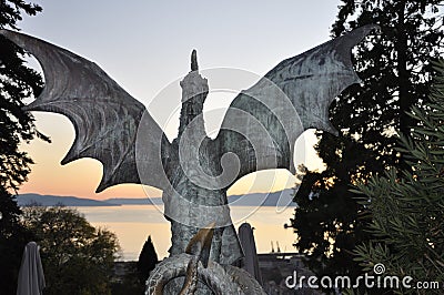 Medieval dragon statue in the castle Gradina, Rijeka city Dragon silhouette closeup in public place. Stock Photo