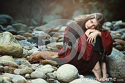 Medieval dressed woman with dreaming expression Stock Photo