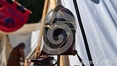 Medieval equipment, helmet, metal glove, armor. Medieval spectacle in times gone by Stock Photo