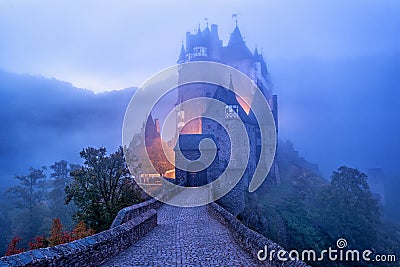 The medieval gothic Burg Eltz castle in the morning mist, Germany Editorial Stock Photo