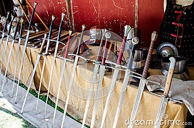 Medieval gun smith shop. Swords and Armor for sale Stock Photo