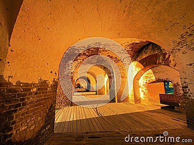 Medieval hallway illuminated with evening sunlight. Stock Photo