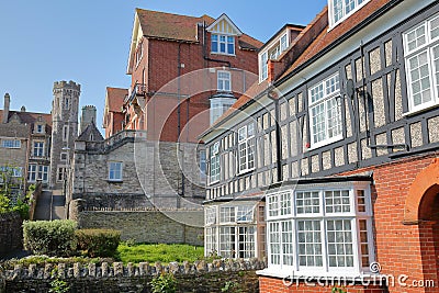 Medieval houses with brickstone and flagstone roofs with Victorian building Purbeck House Hotel in the background, Swanage Stock Photo