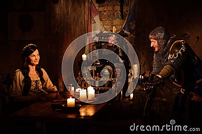 Medieval king and his subjects communicate in the hall of the castle. Stock Photo