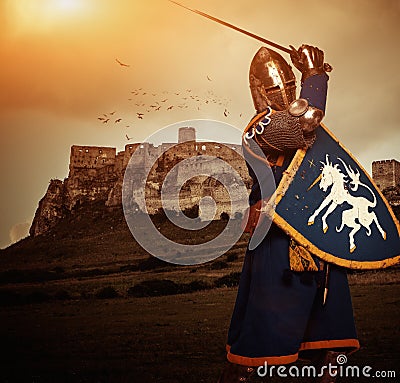 Medieval knight against castle Stock Photo