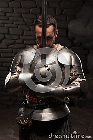 Medieval Knight Kneeling With Sword Stock Photo - Image: 42214271