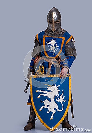 Medieval knight with shield in front of him Stock Photo