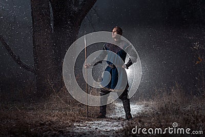 Medieval knight with spear in armor as style Game of Thrones in Stock Photo