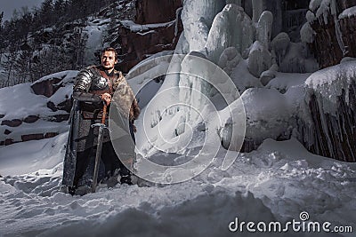 Medieval knight with sword in armor as style Game of Throne Stock Photo