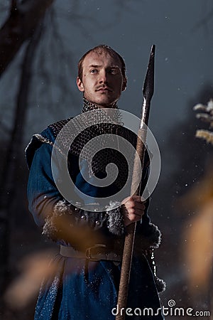 Medieval knight with sword in armor as style Game of Thrones in Stock Photo