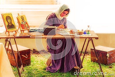 Medieval Lady painting outdoor. Editorial Stock Photo