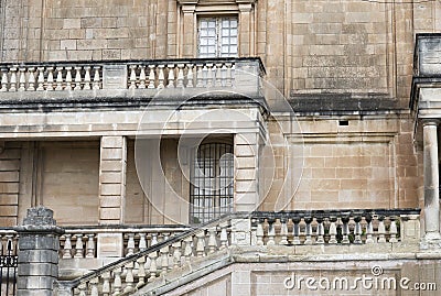 Medieval Maltese Architecture. View Of A Building Facade With Tall Windows And Balconies Stock Photo