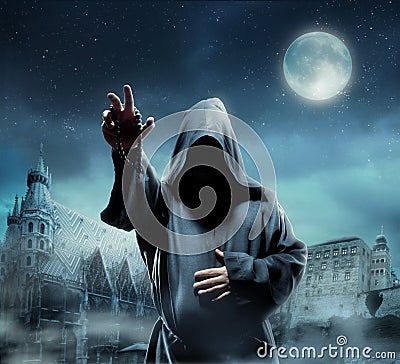 Medieval monk at night Stock Photo