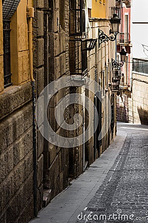 Medieval narrow streets of Alicante old town historic district Santa Cruz Editorial Stock Photo