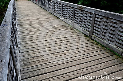 Medieval oak wood, bolted. Bridge over the moat. the railing is made of massive beams, between which several thin oak rods are wov Stock Photo