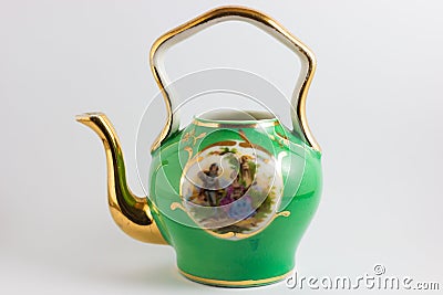 Medieval romantic green and gold teapot Stock Photo