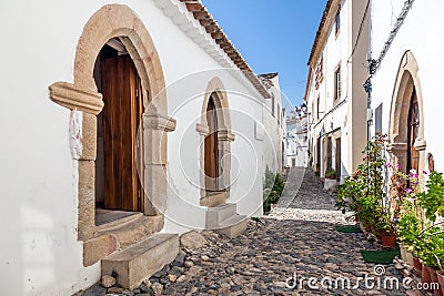 Medieval Sephardic Synagogue (13th / 14th century) in the left in Castelo de Vide Stock Photo