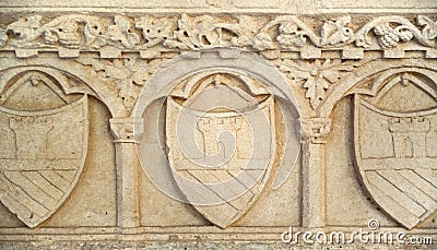 Medieval shield in stone wall texture backgrouund Stock Photo