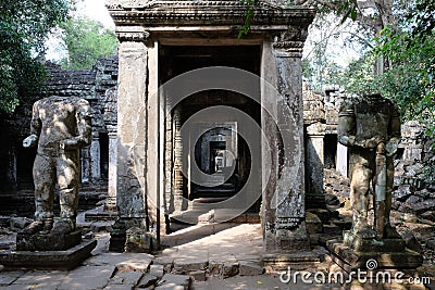 Medieval stone statue of a headless man. Ancient ruins in Cambodia Stock Photo