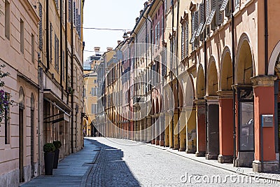 Medieval street in old town of Modena, Italy Stock Photo