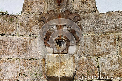 Medieval wall fountain Stock Photo