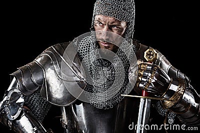 Medieval Warrior with chain mail armour and sword Stock Photo