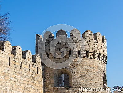 Medieval watchtower. Ancient castle palace in Baku. Castle wall and tower gate. Stock Photo