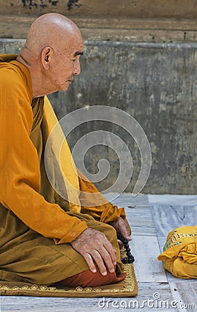 Meditating Buddhist Monk at Mahabodhi Temple, India Editorial Stock Photo