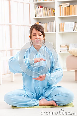 Meditating sitting woman Stock Photo