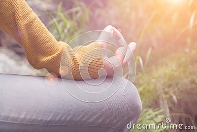 Meditating woman fingers closeup Stock Photo