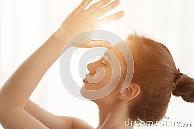Meditating. Woman Namaste Hands To Forehead, Side View Stock Photo