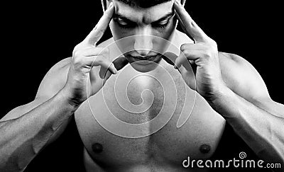 Meditation - muscular man in deep concentration Stock Photo