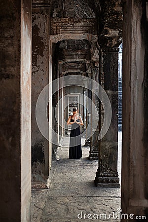 Meditation. Religious Woman Praying, Meditating At Angkor Wat Temple Stock Photo