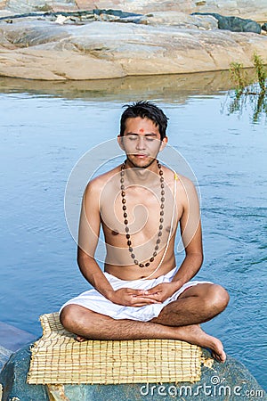 Meditation by the river Stock Photo