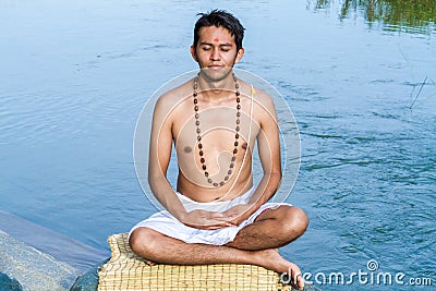 Meditation by the river Stock Photo